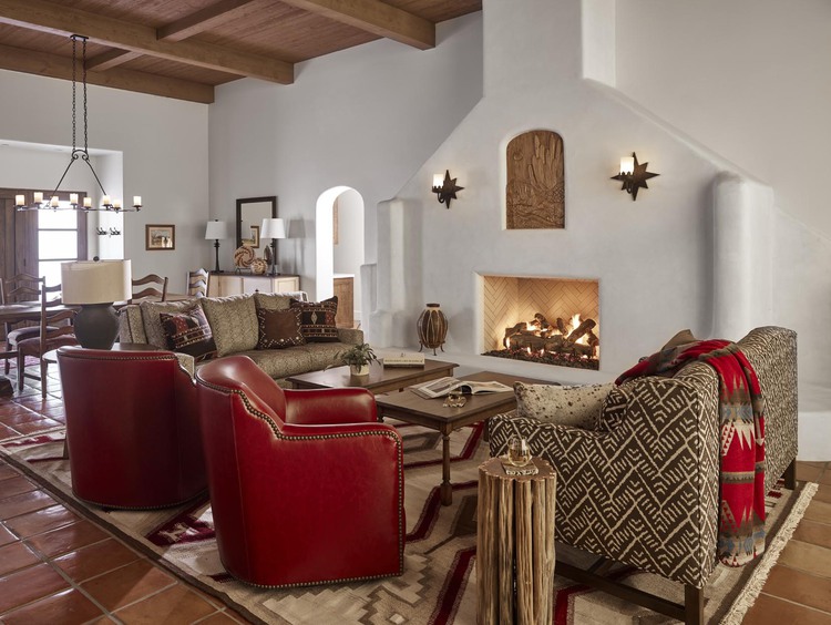 Living room space with a fireplace and armchairs