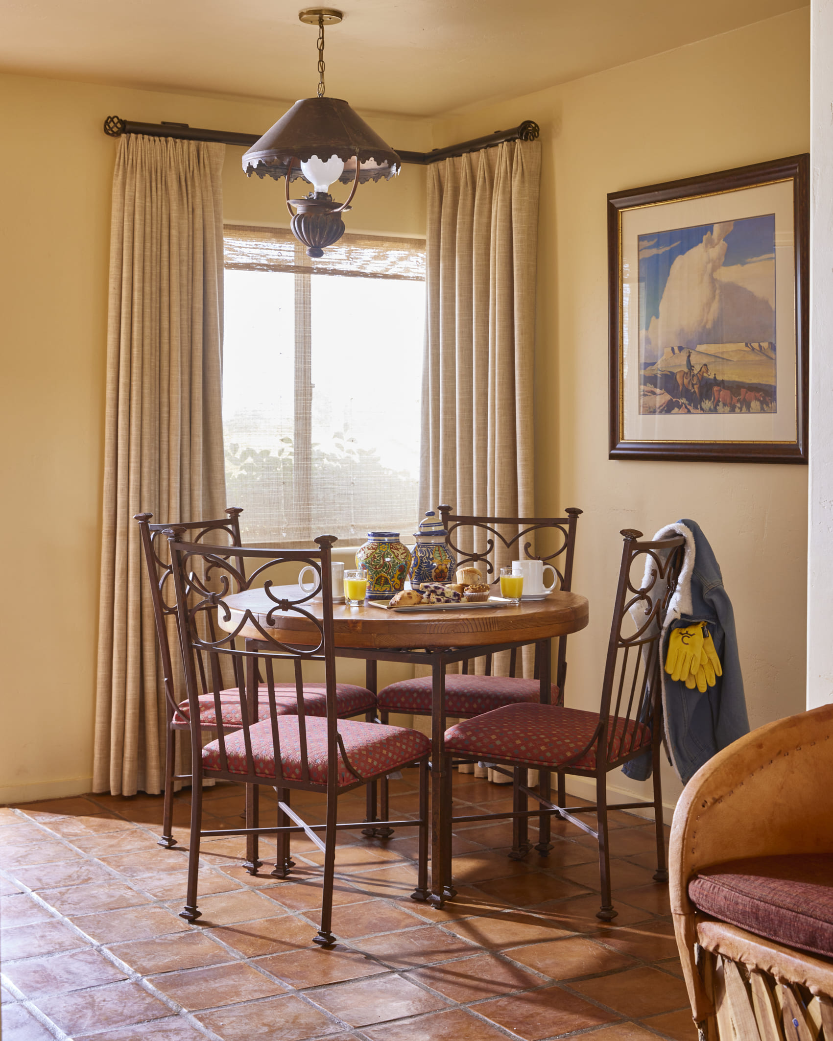 King bed with side table and light coming into room